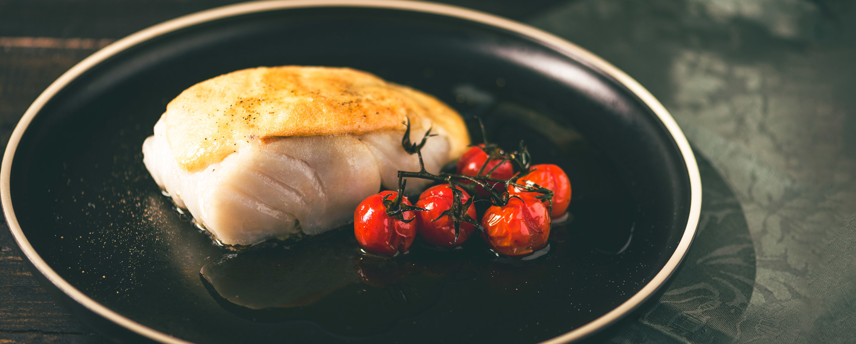Bacalao gratinado con ali-oli y tomates confitados