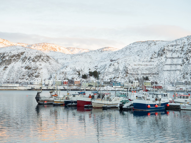 Kjøllefjord by the water with fishing boats in front